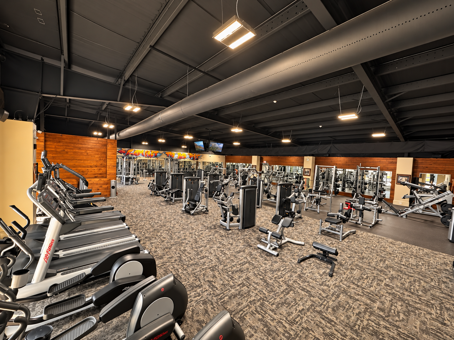 BFIT gym floor with cardio and strength training equipment